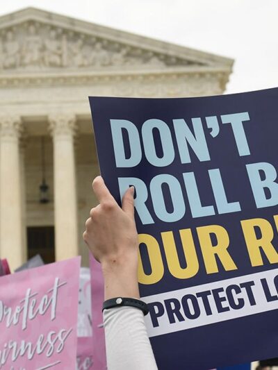 "Don't roll back our rights" protest sign in front of the U.S. Supreme Court