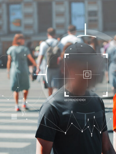 Face recognition and personal identification technologies in street surveillance cameras covering people's faces.