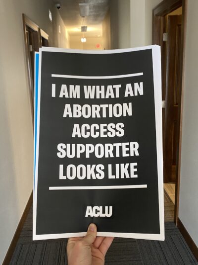 Image of a sign that says, "I am what an abortion access supporter looks like."