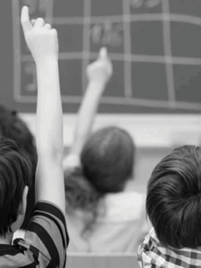 `black and white image of a classroom