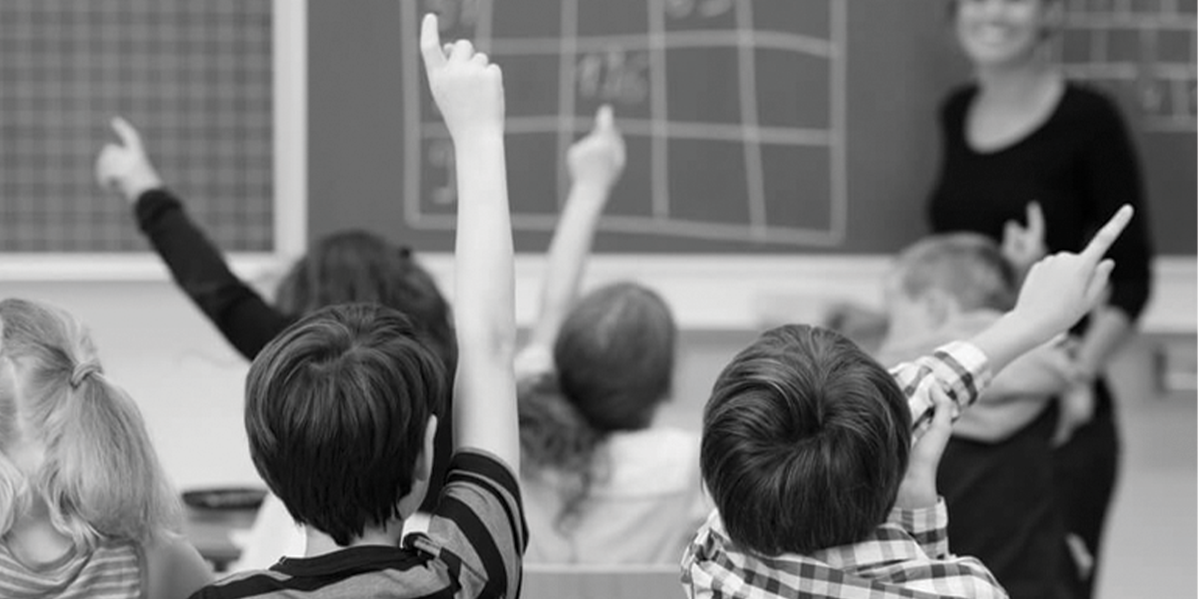 `black and white image of a classroom