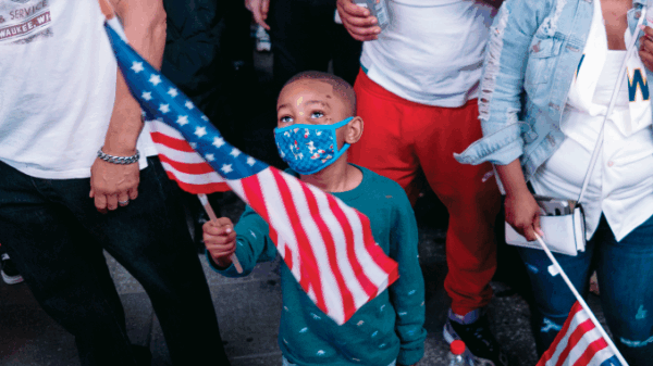 Image of a child holding a flag