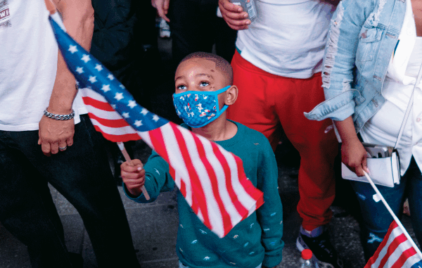 Image of a child holding a flag