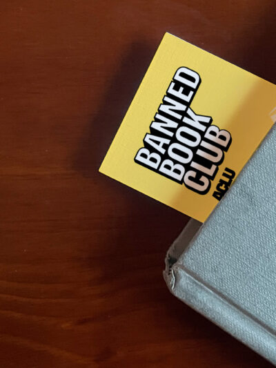 An ACLU bookmark sticking out of a book.