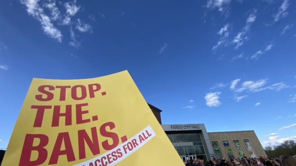 Image of a poster that reads, "STOP THE BANS."