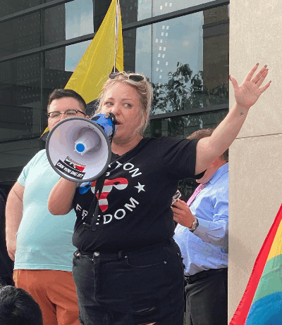 Person speaking at a protest in North Dakota.