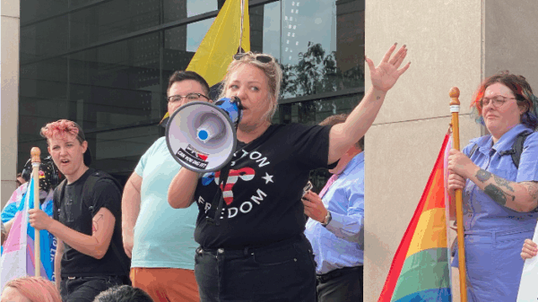 Person speaking at a protest in North Dakota.