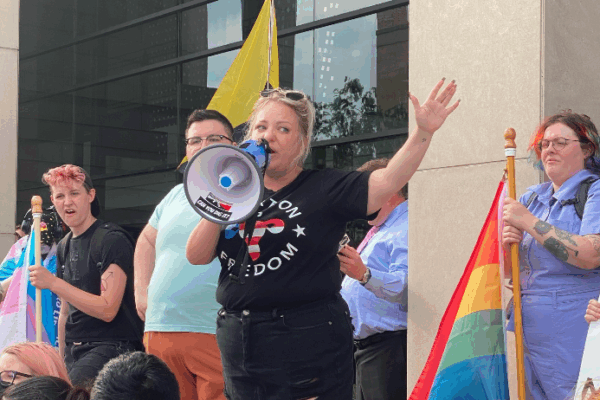 Person speaking at a protest in North Dakota.