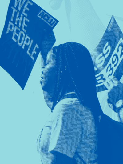 Image of two people at a protest placed over a blue background with the statue of liberty.