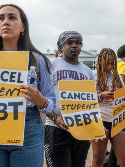 People protesting for student loan forgiveness.