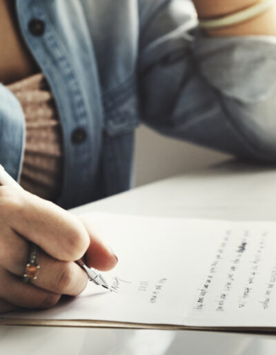 Person writing a letter