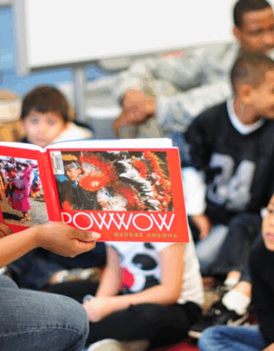 Students learning about Pow Wows