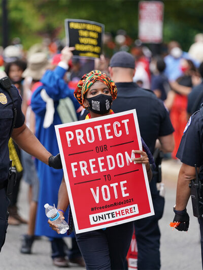 The Capitol Police arrest and escort a demonstrator during the Voters Rights protest on Capitol Hill.