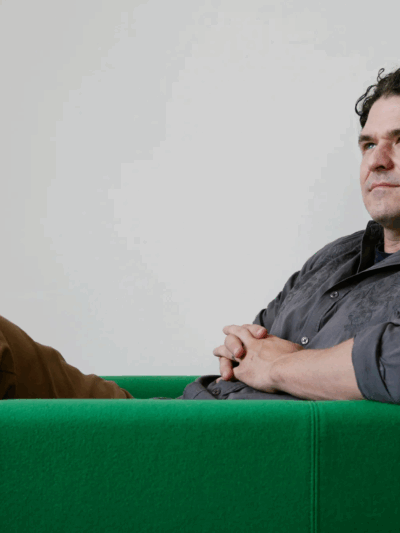 Dave Eggers in a green chair