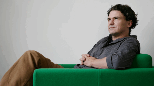Dave Eggers in a green chair