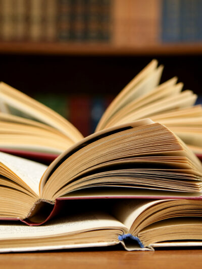Several books open on a table