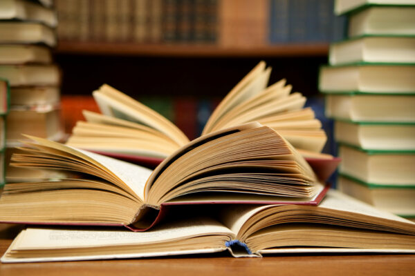 Several books open on a table