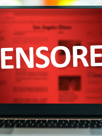 A laptop with the word "CENSORED" in white on a red background.