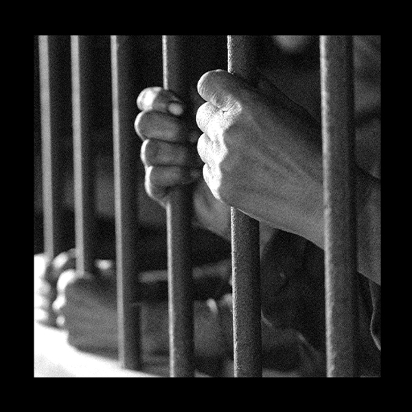 Hands behind bars.