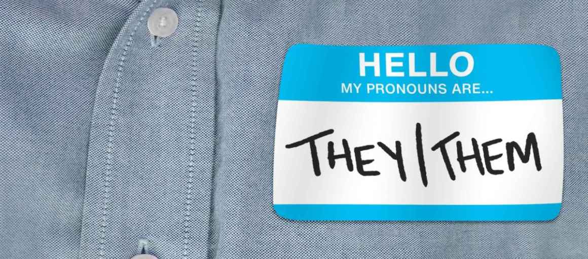 Image of a shirt with a pronoun tag that reads, "they/them"