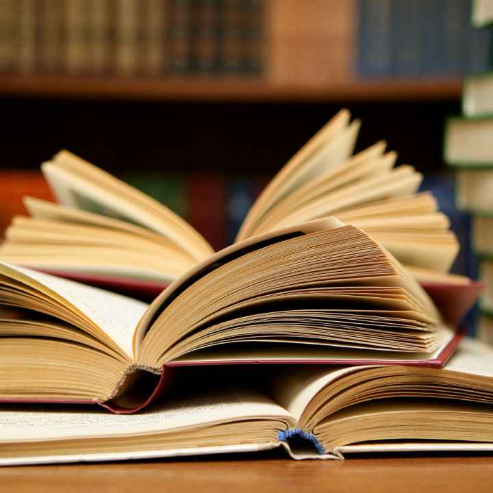 Several books open on a table